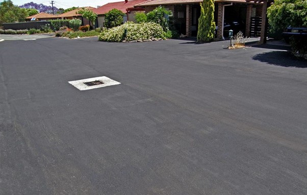 New asphalt driveway with drainage
