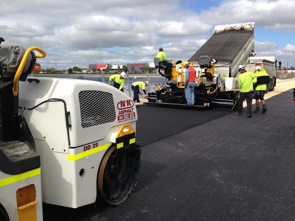 asphalt laying team with safety equipment