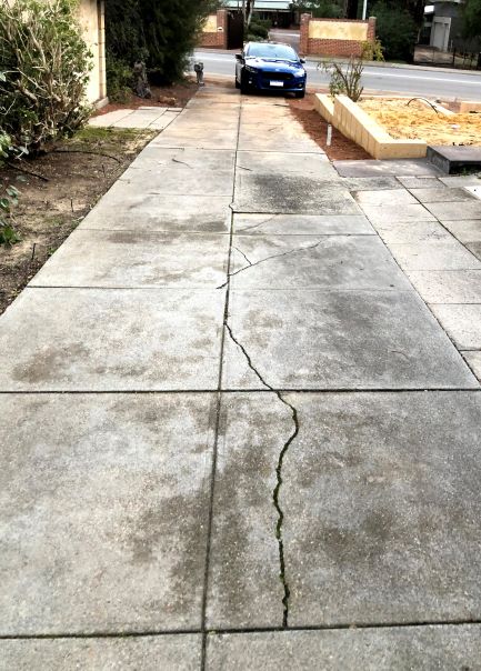 old cracked concrete driveway